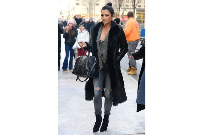 Shay Mitchell stays warm in New York by layering several knits and a fur-trim coat with her ripped Citizens of Humanity skinny jeans ; Photo: Getty