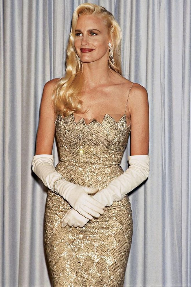 While the popularity of elbow-length gloves was waning, they made even more of a statement when Daryl Hannah paired them with her glamorous gold dress and long blonde waves.