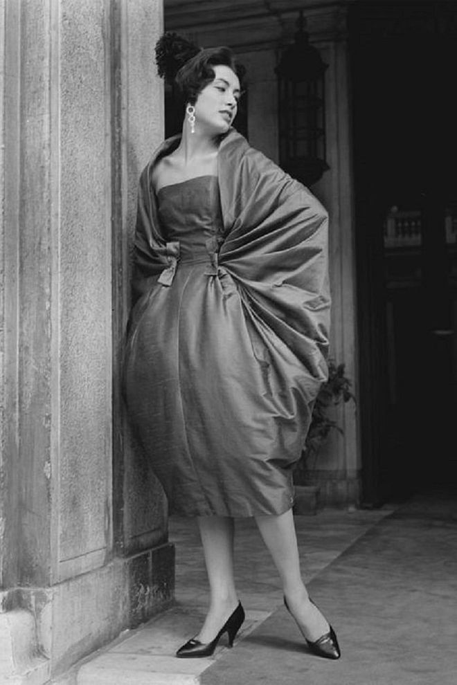 A woman modeling 'Rondo', a dress made by Italian designer Simonetta, outside the Palazzo Grassi in Venice.

Photo: Getty