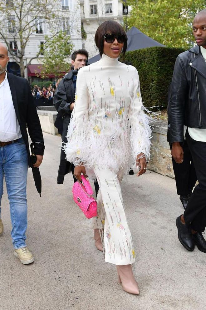 Naomi Campbell wore a feathered look to check out the new Valentino collection.

Photo: Getty