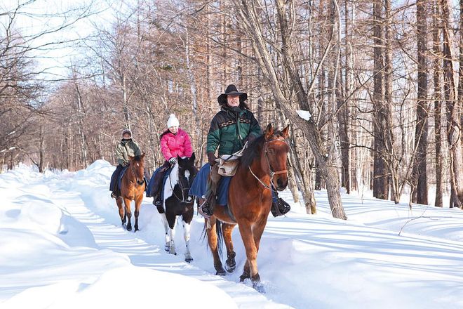 Saddle up for a scenic horseback ride, one of the non-ski activities available at the resort.
