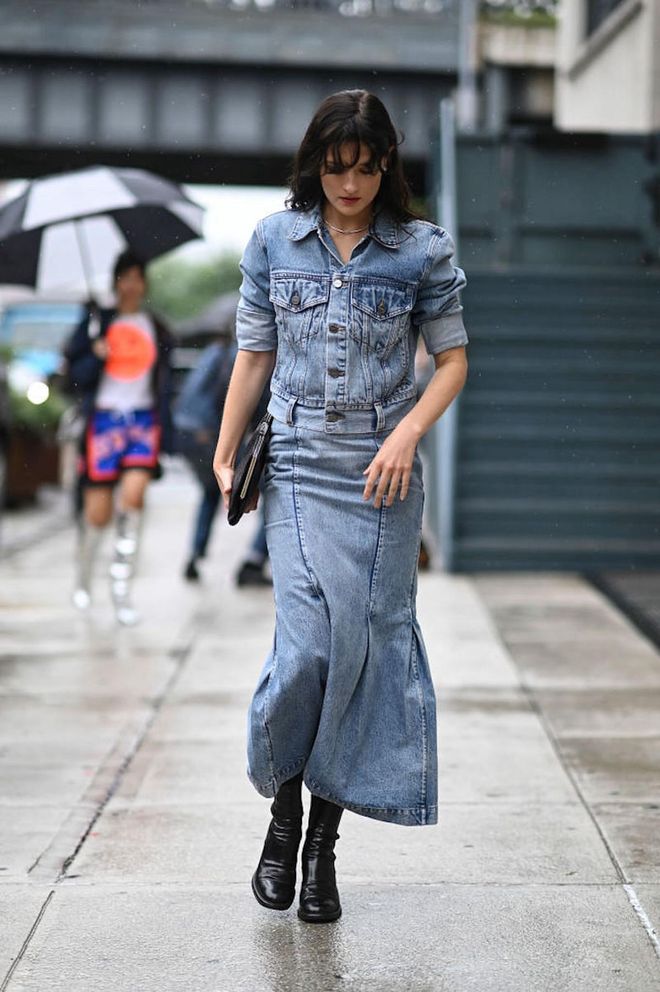 NEW YORK, NEW YORK - SEPTEMBER 11: A guest is seen wearing a blue denim top and skirt outside the Khaite show during New York Fashion Week S/S 2023 on September 11, 2022 in New York City. (Photo by Daniel Zuchnik/Getty Images)
