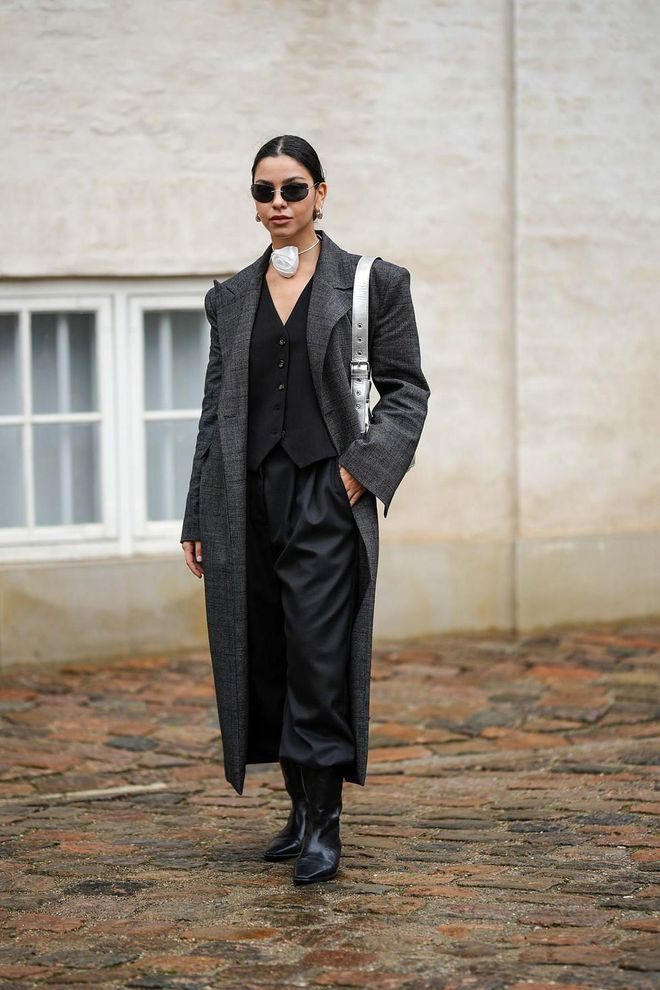 For Copenhagen Fashion Week’s rainy start, one guest contrasted a moody suit with a silky rosette choker.