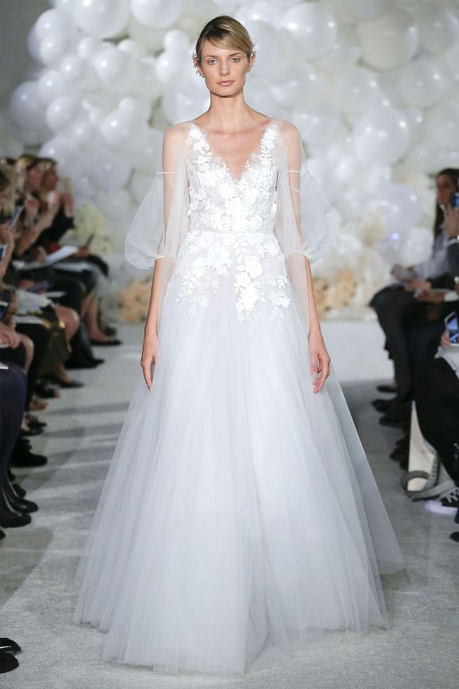 Sheer capes can take the place of veils over romantic gowns that call for a whimsical trail at the back, Mira Zwillinger gown, mirazwillinger.com. Photo: Mira Zwillinger