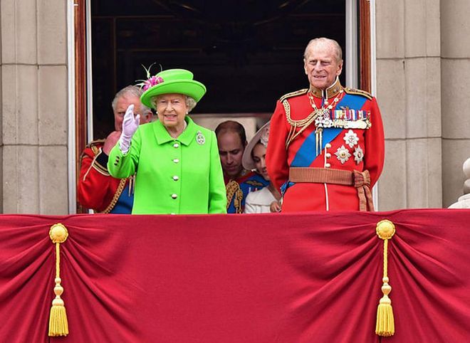 Queen Elizabeth II and Prince Philip standing on the balcony at the Trooping the Colour, the Queen's annual birthday parade, in London, England.