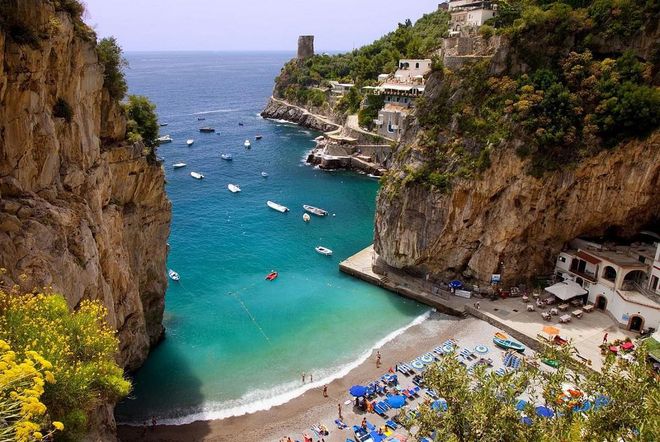 Marini di Praia is a pebble beach located at the foot of a cliff on the Amalfi Coast and home to several restaurants and even one of the most fashionable dance clubs in the world. But it's the bright blue umbrellas and water that earns it a spot on this list.