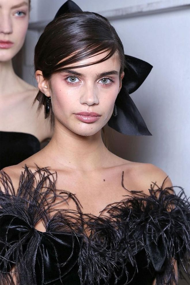 At Marchesa, the hair was pulled back into a textured chignon and then a giant stiff bow (about the size of the models' heads) was pinned into the base.