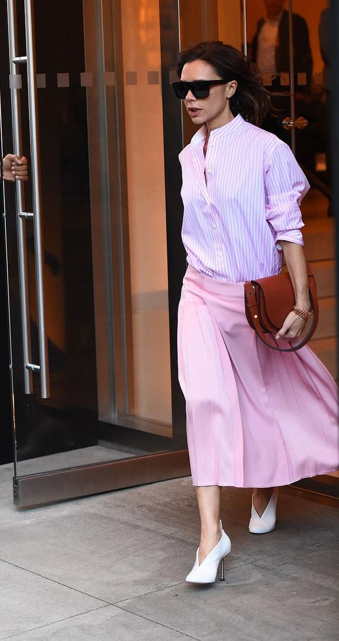 For a more casual date after office hours, you can pare back the look  with a classic blouse and skirt combo for work. Don’t be afraid to match pink with pink for a one-tone outfit. Victoria elevates the look by breaking the monotone with stripes on top as well as opting for a longer, more flowy skirt that grazes just above the ankles. Roll up ’em sleeves on a busy day, it’s the perfect outfit for women on-the-go.