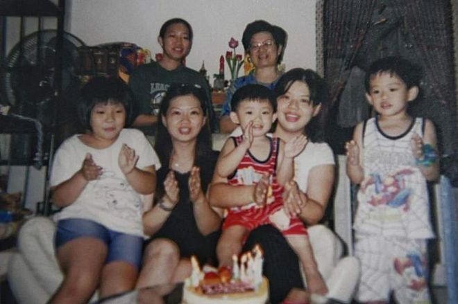 An old photo of Laura Lee (seated, second from left) with her then young children, her sister (seated, second from right), her mother (standing, right) and her domestic helper (standing, left). ST PHOTO: CHONG JUN LIANG