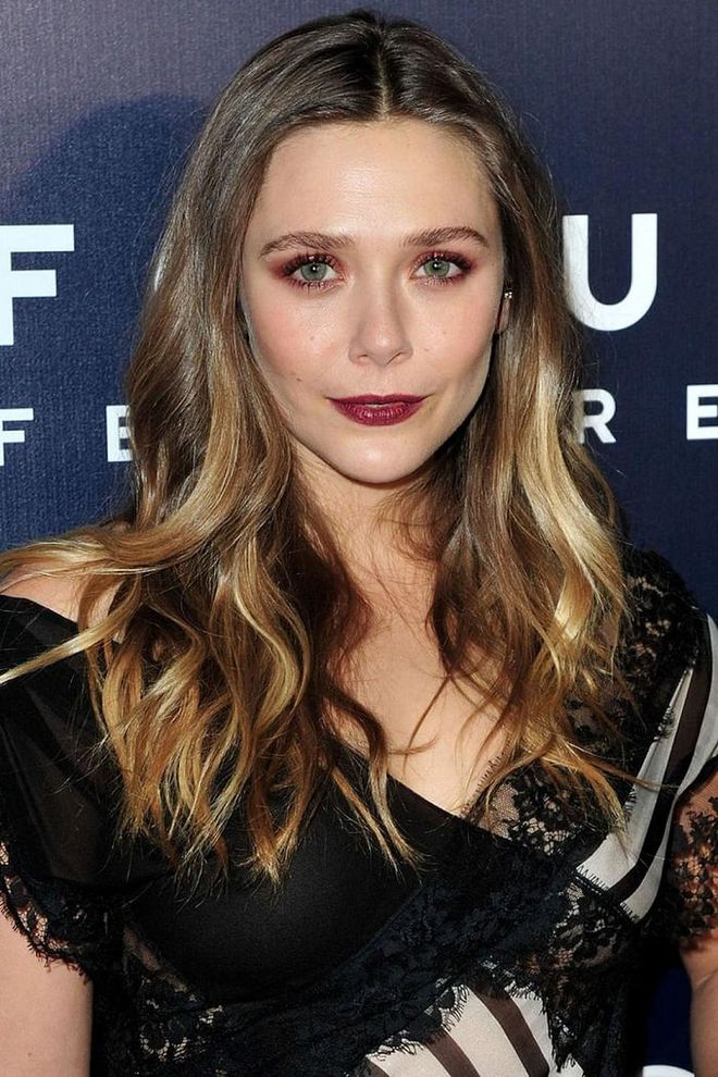 Rocking two of the biggest beauty trends of the night, we love how Olsen paired peachy eyeshadow with a vampy berry lipstick.