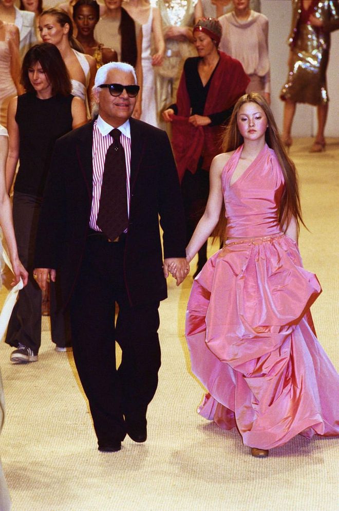 Karl Lagerfeld with Devon Aoki at the Chanel haute couture 1999 show.