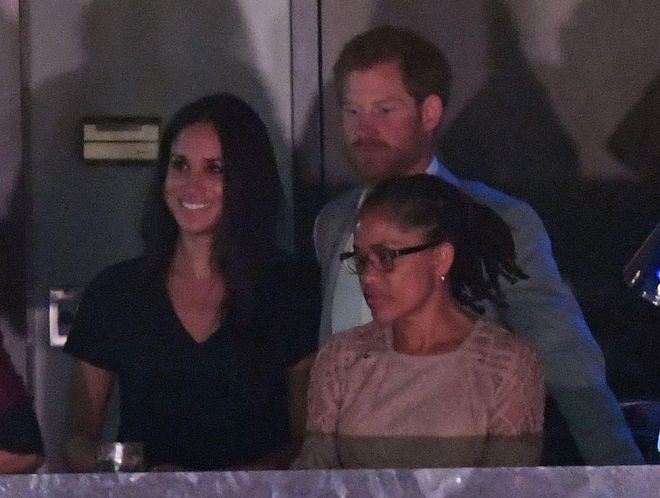 While Meghan was initially seated separately from Harry in a private box with her mother and close friends, he stopped by toward the end of the event to say hello.