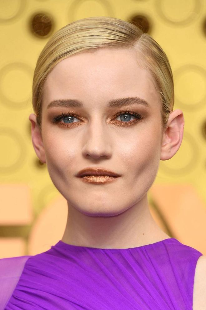 Christmas may be the only time that metallic eyes and lips feel appropriate. Copy actress Julia Garner and line your eyes with the Victoria Beckham Beauty Satin Kajal Liner in Bronze, and MAC Frost Lipstick in Bronze Shimmer. Photo: Getty
