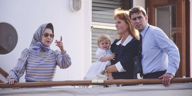 Queen Elizabeth, Sarah, Duchess of York, and Prince Andrew stand together on the Royal Yacht Britannia. Photo: Getty