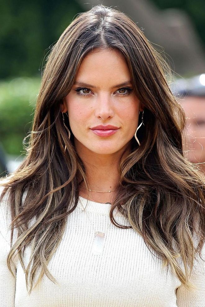 Alessandra Ambrosio proves that high volume hair can be achieved with a deep middle part and a bit of scrunching at the roots. Photo: Getty
