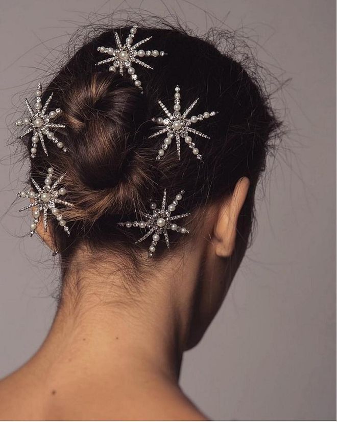 Don't settle for just one hair accessory. A sparkly pin looks so much cooler when done in excess. Photo: @leletny
