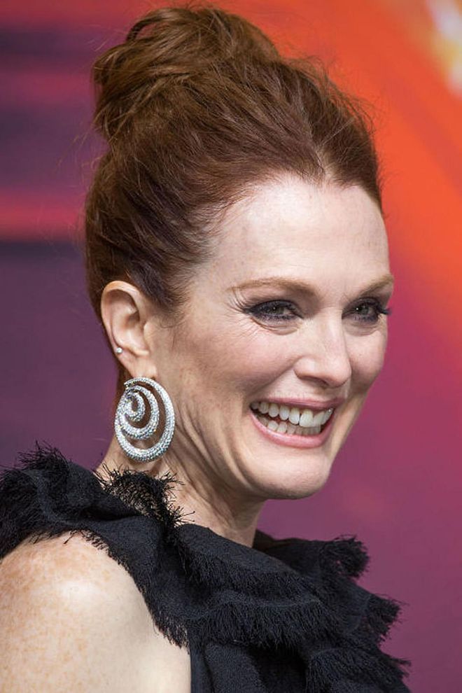 Julianne Moore is the pro at playing with shape and texture from this voluminous top knot to her swirling diamonds and fringed neckline. Photo: Getty