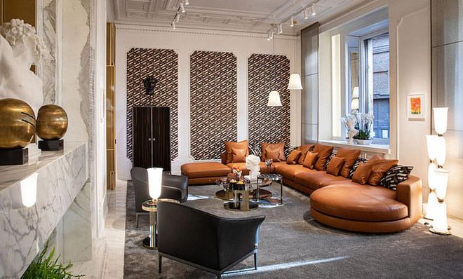 Signature’s subtle curves soften the look in this living room. (Photo: Versace)