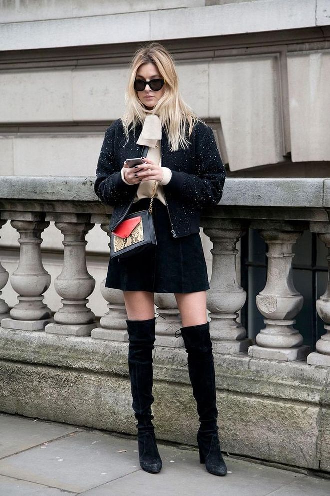You probably own most of these wardrobe staples already - an A-line skirt, a cashmere jumper and a jacket. While wearing thigh-highs might feel daring, in reality you're only flashing a small dose of skin. Photo: Getty 