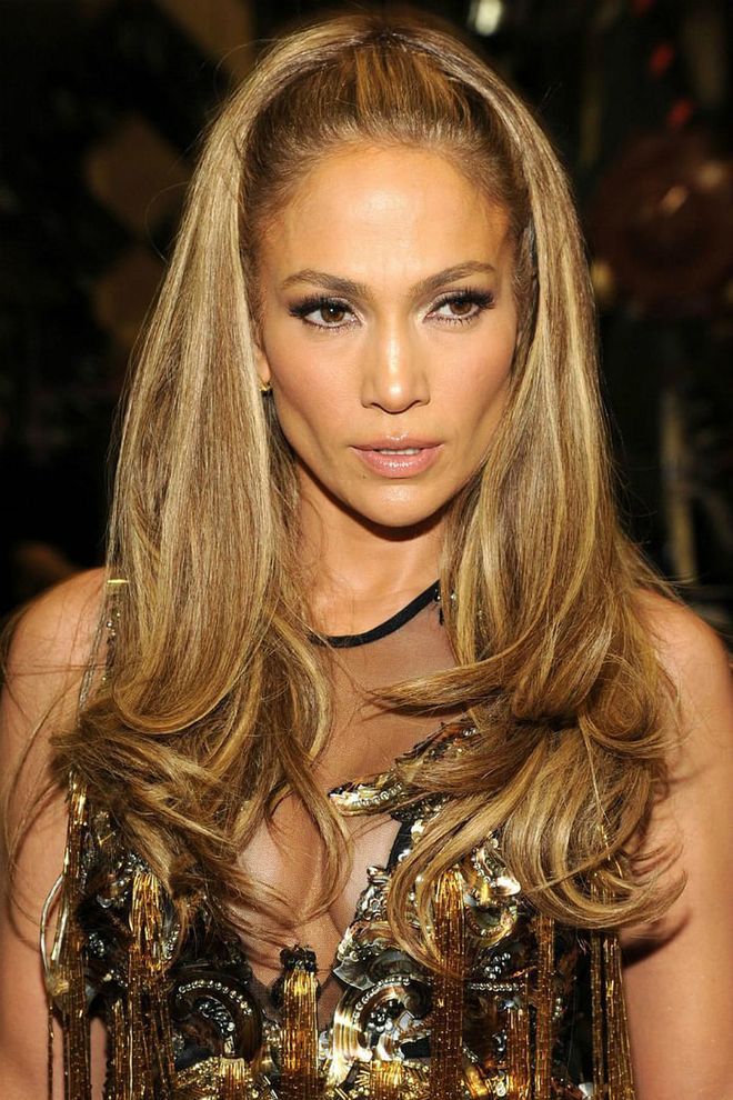 Jennifer Lopez redefined diva hair with her iconic half-up hairstyle.

Photo: Getty