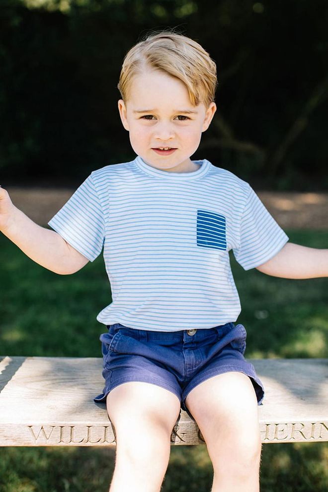 Prince George rocks stripes and shorts at this sweet summer shoot at his family's Norfolk home in July 2016. The swing he sits on is engraved with his parents' names, "William &amp; Catherine."
