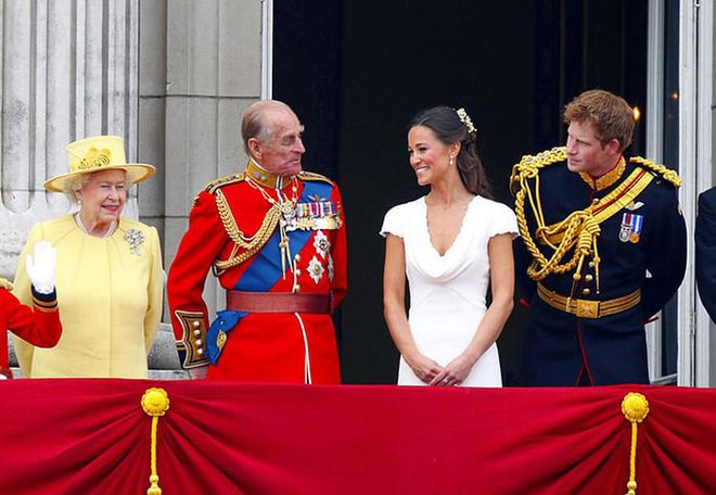 Queen Elizabeth, Prince Philip, Pippa Middleton (Kate Middleton's sister), and Prince Harry awaiting William and Kate's arrival on the balcony of Buckingham Palace following their wedding ceremony.