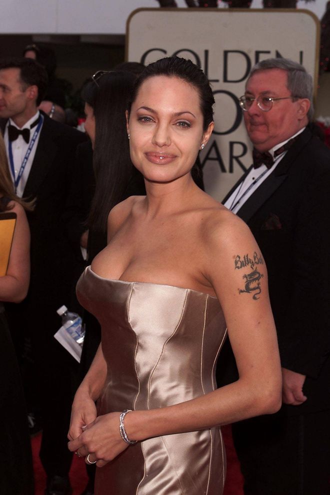 She wasn't nominated for an award in 2001, but that didn't stop Jolie from having a winning fashion moment on the red carpet in this strapless Versace gown which showed off her tattoos.