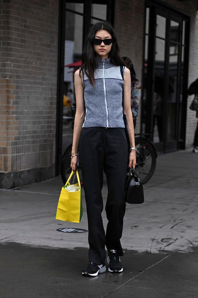 NEW YORK, NEW YORK - SEPTEMBER 11: Model Mika Schneider is seen wearing a gray zippered vest and black pants outside the Khaite show during New York Fashion Week S/S 2023 on September 11, 2022 in New York City. (Photo by Daniel Zuchnik/Getty Images)