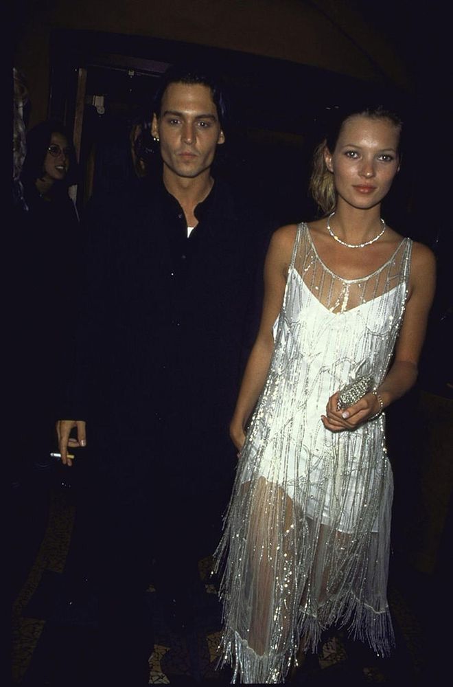 With then-beau Johnny Depp, the supermodel sparkles in a silk slip by Calvin Klein. Embellished with sequins, this flapper dress was once worn by Mrs. Errol Flynn, 1994. Photo: Getty