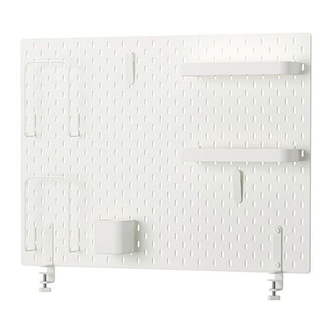 A pegboard is the perfect organisational blank canvas. Place them by your desk and sprinkle with pretty gadgets, pictures, and accessories to keep office tools in place for some real organisational edge.