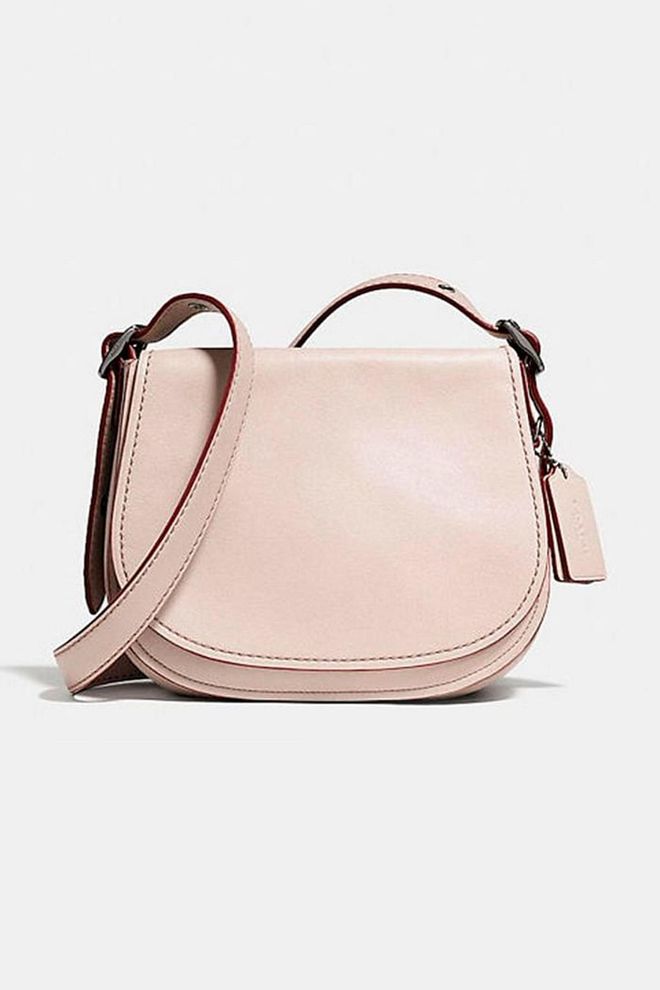 In celebration if its 75th anniversary, Coach has re-imagined its original pouch bag in glove-tanned leather, making for the ultimate handbag investment.