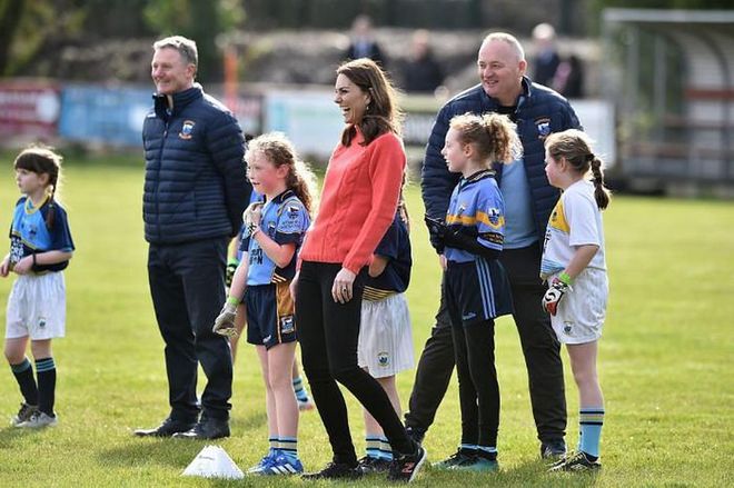 Kate stands with a group of young players during an engagement at Salthill Knocknacarra GAA Club.

Photo: Getty