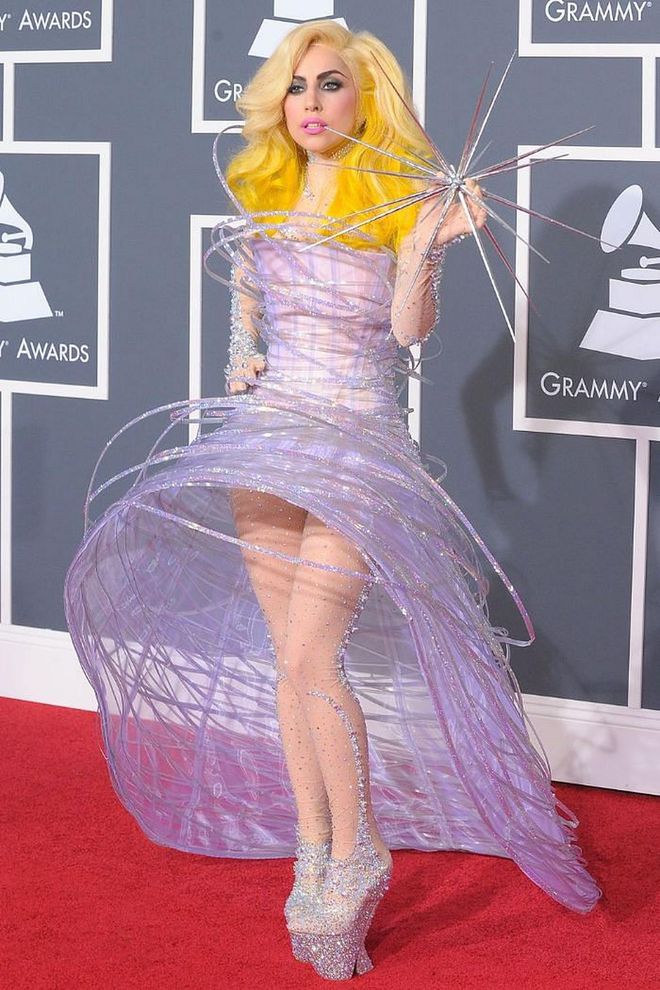 At the turn of the decade Lady Gaga was riding high off the release of hits such as 'Paparazzi', 'Bad Romance' and 'Telephone', and was experimenting with a more futuristic aesthetic - summed up by her appearance at the 2010 Grammys. The singer arrived wearing a sculptural Giorgio Armani dress covered in glittering tubes, paired with towering crystal-encrusted platforms. She carried in her hand a spiked star, finishing off the galactic look.

Photo: Getty