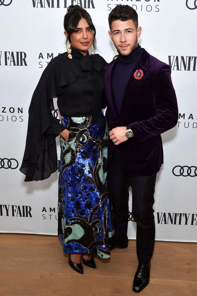 Priyanka Chopra and Nick Jonas attended the Amazon Studios pre-Golden Globes party in LA; she in a sequinned skirt and flared-sleeve top by Elie Saab, he in a velvet jacket.

Photo: Amy Sussman / Getty