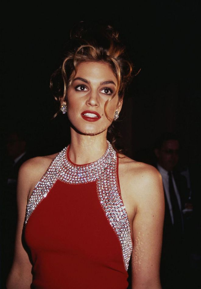 The supermodel donned a scarlet halter neck gown embellished with crystals, in 1993. Photo: Getty 