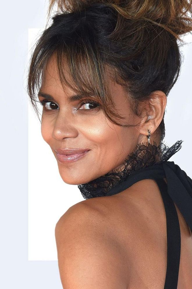 "Longer bangs are ideal to help mask the aging process since it softens the facial features, emphasizes the eyes and also can discreetly hide fine lines and wrinkles. It’s best to add layers so that there is movement and texture, rather than having stiff, coiffed hair that looks like a helmet."—Frederic Moine, celebrity hairstylist. Photo: Getty