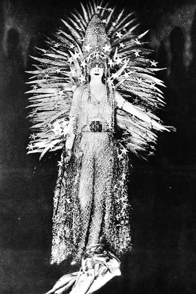 The Italian heiress Marchesa Casati was known for her wild parties, pet cheetahs and bold sense of style – which included occasionally slipping on live snakes as necklaces. For a 1922 party, she wore a dress that may have inspired Rihanna's CFDAs look: a net of diamonds by Worth, with a gold-feather sun headdress set against a diamond tiara. Even her fringe was covered in jewels and glitter.
