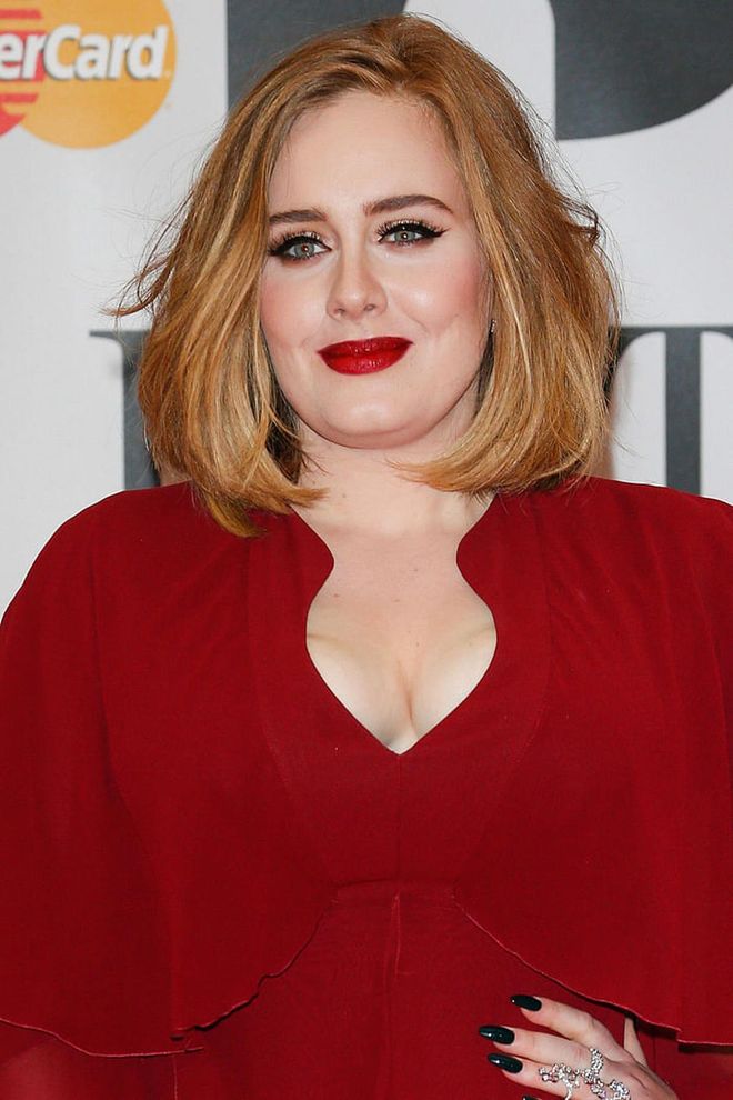 The singer hit a high note at the BRIT awards wearing a vampy red lipstick and dress.

