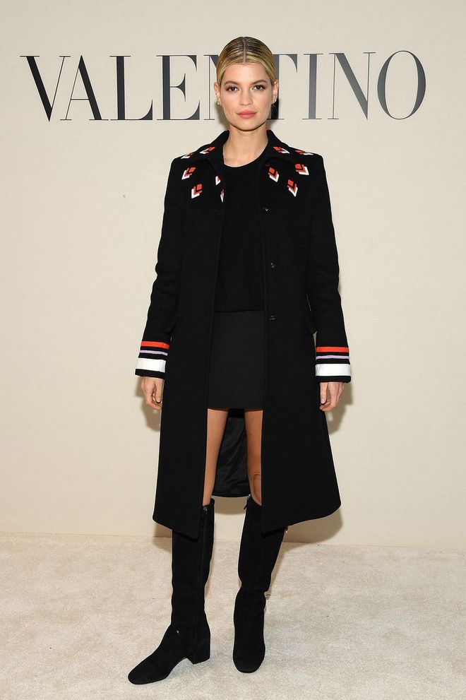 Pixie Geldof opted for a subtle patterned coat and knee-high boots.

Photo: Pascal Le Segretain / Getty