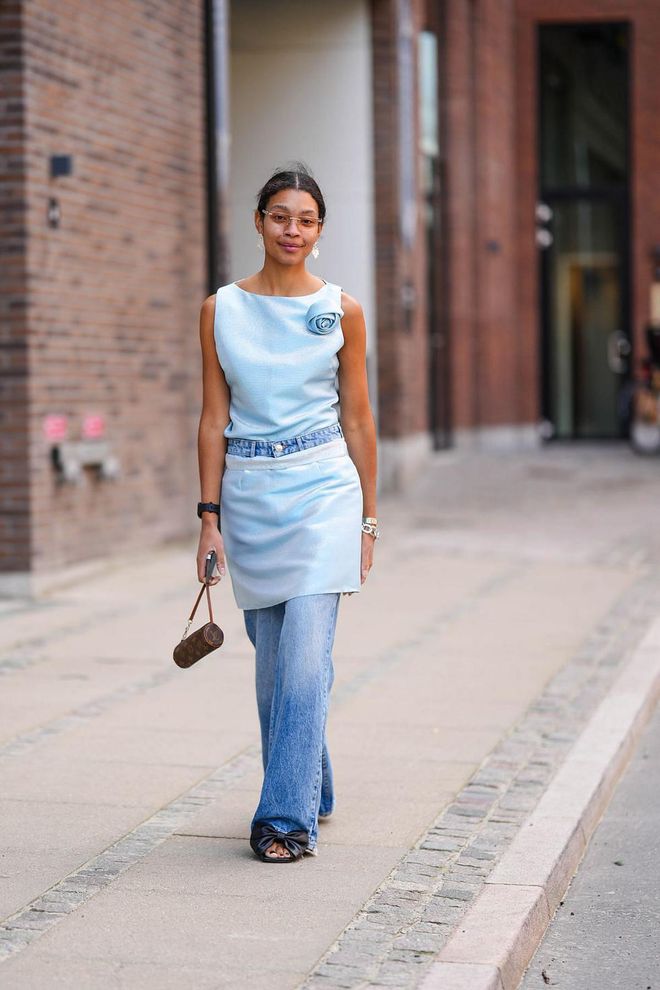 Outside the shows, some guests practiced a styling trend for spring/summer 2024—matching separates broken up by a pair of jeans or trousers—with a rosette-embellished top.