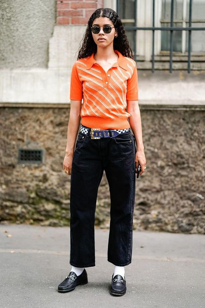 Fuss-free and chic, team a brightly-hued polo with a navy pants and loafers for a relaxed yet put-together look. Photo: Getty