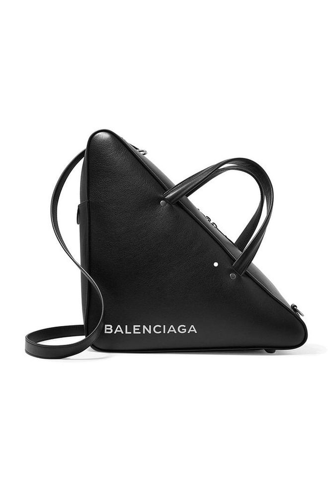 The most fashion forward of shoppers will carry Balenciaga's triangle duffle this season, a structured style inspired by retro ski boot bags. 