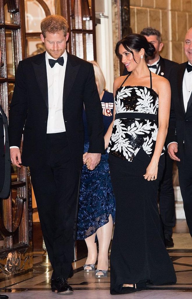 Meghan attended the Royal Variety Performance at the Palladium Theatre in London. The Duchess wore a black and white sequined strapless top by Safiyaa and a black maxi skirt from the same brand. She paired the look with black pumps. 