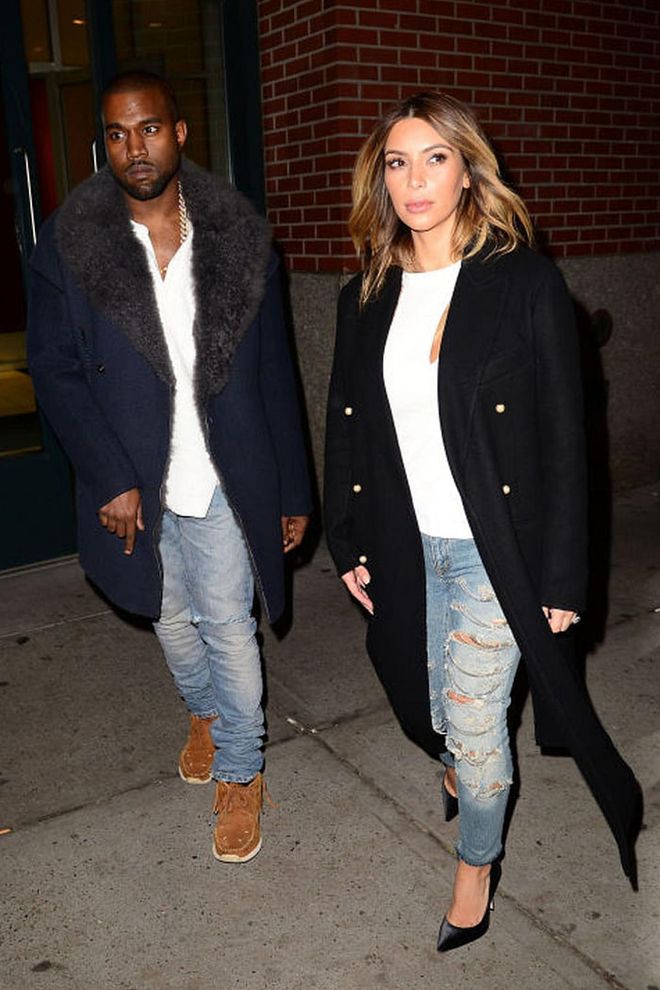  In matching light-wash denim and white tees, the soon-to-be-engaged couple differentiated their looks with a sleek black coat and pumps for her and a navy fur-lined coat and suede sneakers for him.Photo: Getty