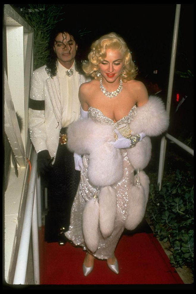 Sparkling in Harry Winston jewels and a bedazzled gown, with Michael Jackson, at the 1991 Academy Awards. Photo: Getty 


