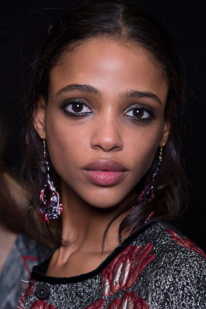 The smoky eyes that were seen across London were featured at Alberta Ferretti, too, with kohl liner and fading silver eyeshadow. The hair had a similar lived-in feel with a wavy, half-up half-down style.