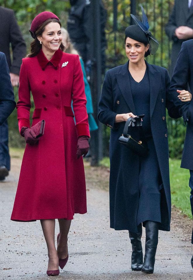 Kate was festive in a red Catherine Walker coat and matching burgundy accessories.