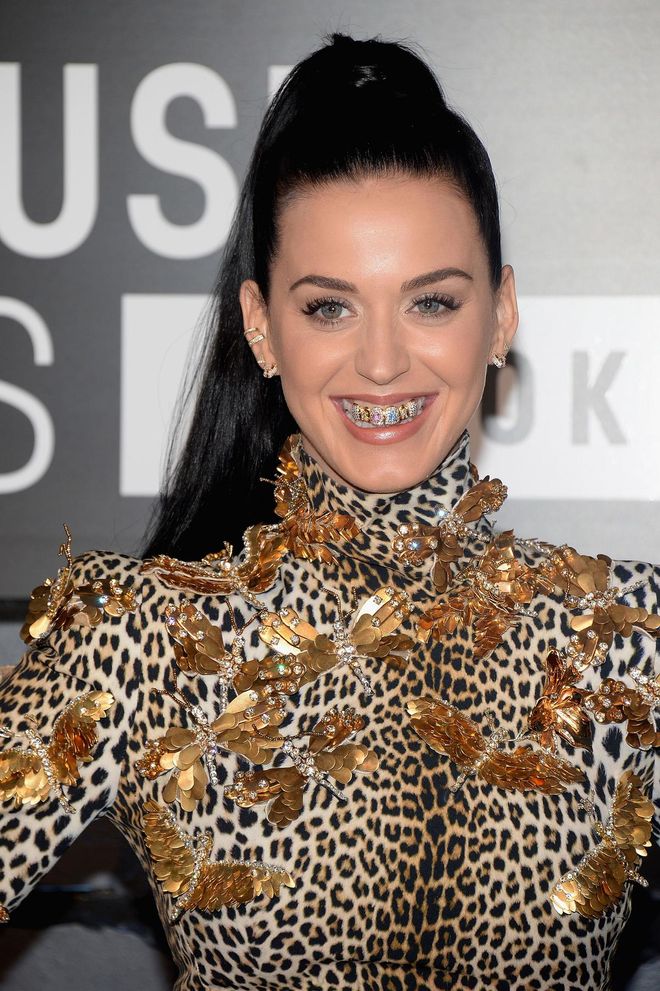 Her fierce 2013 MTV Video Music Awards look combined leopard print, golden butterflies and a shiny grill