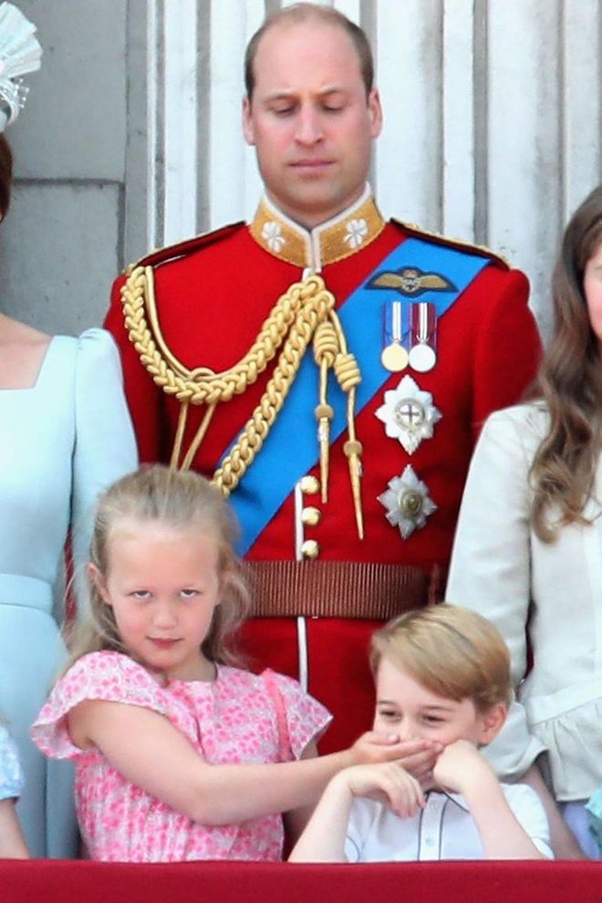 Prince William watches on as Savannah Philips and Prince George play around on the balcony of Buckingham Palacing during Trooping the Colour 2018.

Photo: Getty