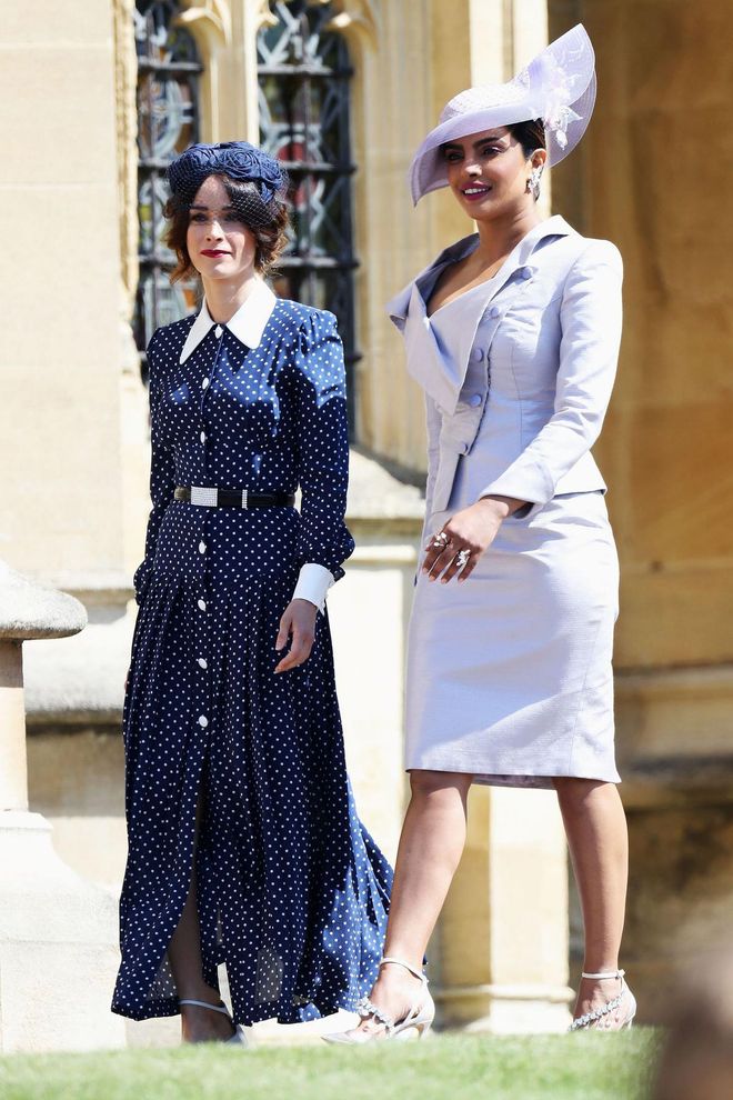 Chopra wears custom Vivienne Westwood and a Philip Treacy hat; pictured with Abigail Spencer, wearing Alessandra Rich. Photo: Getty
